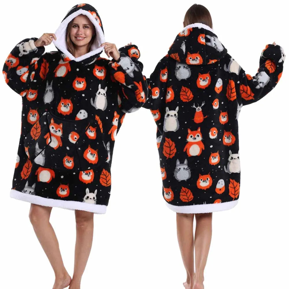 A woman models an oversized patchwork fleece hoodie featuring various animal patches in black and white.