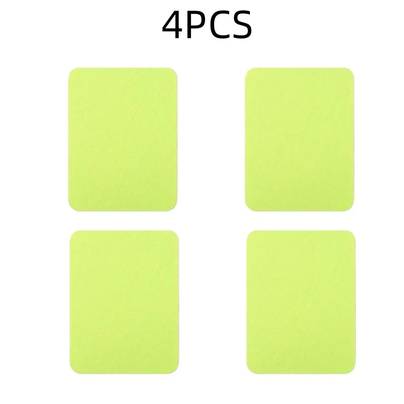 A set of four light green iron-on fabric repair patches.
