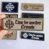A collection of tactical embroidered patches featuring the text Time for another Crusade on various colored backgrounds.