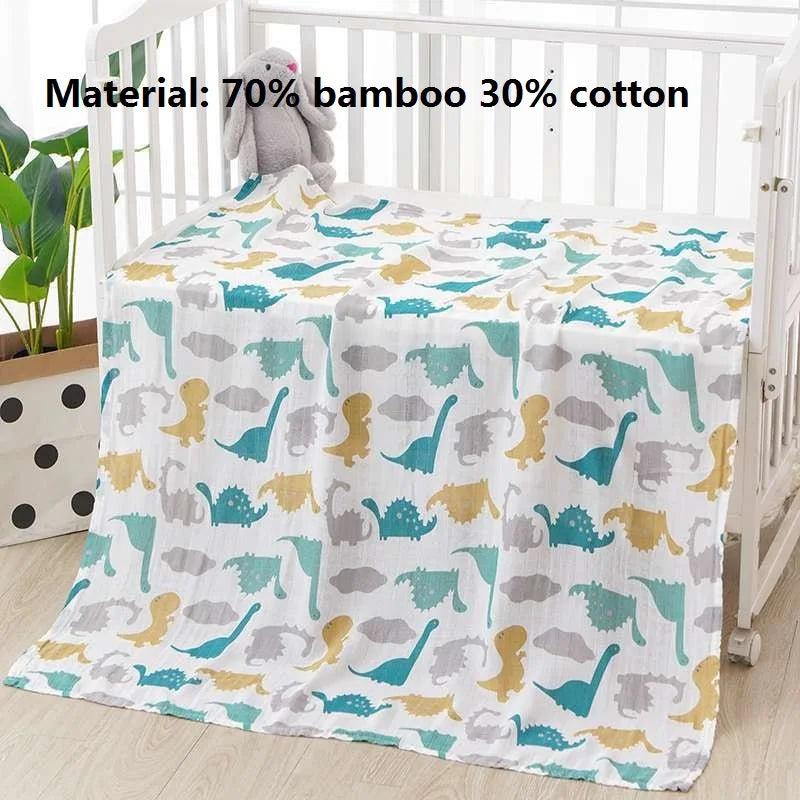 A light patterned muslin swaddle blanket featuring various dinosaur silhouettes for a baby.