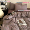 A striped duvet cover set featuring pink and gray stripes, including a duvet cover, pillowcases, and a comforter.