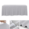 A white stretchable waterproof rectangle tablecloth draped over a table.