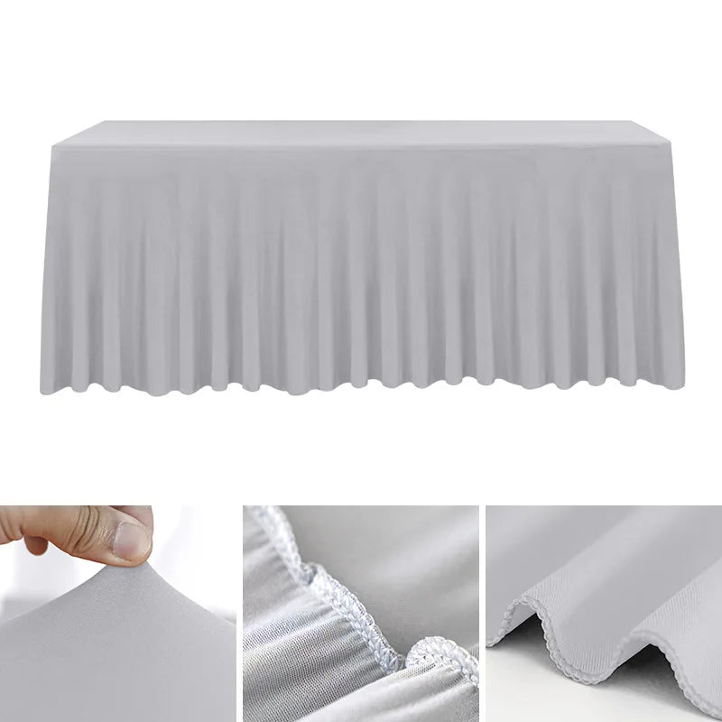 A white stretchable waterproof rectangle tablecloth draped over a table.
