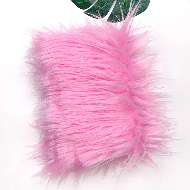 Pink faux fur plush fabric used for sewing and crafting