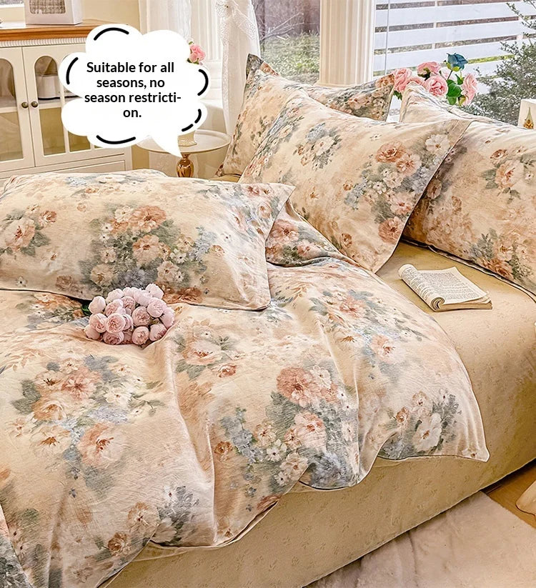 A beige floral cotton duvet cover and pillow set displayed on a bed with natural light.