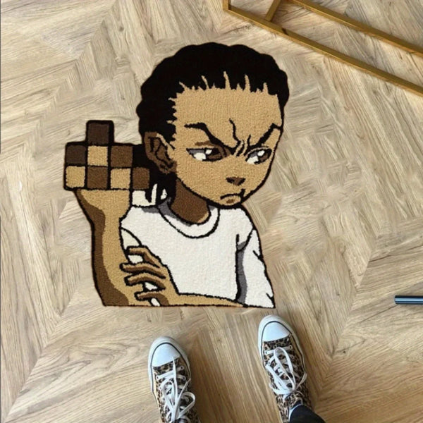 A cartoon character shaped floor rug depicting a fierce-looking figure with dark hair and a clenched fist.