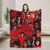 A graphic plush throw blanket featuring a collage of King of Pop music icons in red and black tones.