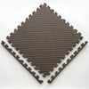 A dark brown interlocking foam play mat with a diamond pattern, shown from above.
