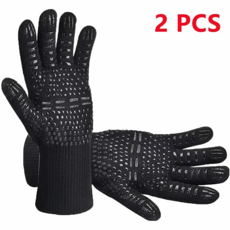 A pair of black heat resistant BBQ gloves with non-slip silicone grip