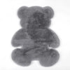 A gray plush bear-shaped non-slip area rug.