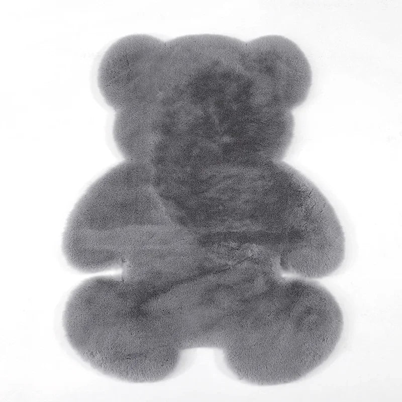 A gray plush bear-shaped non-slip area rug.