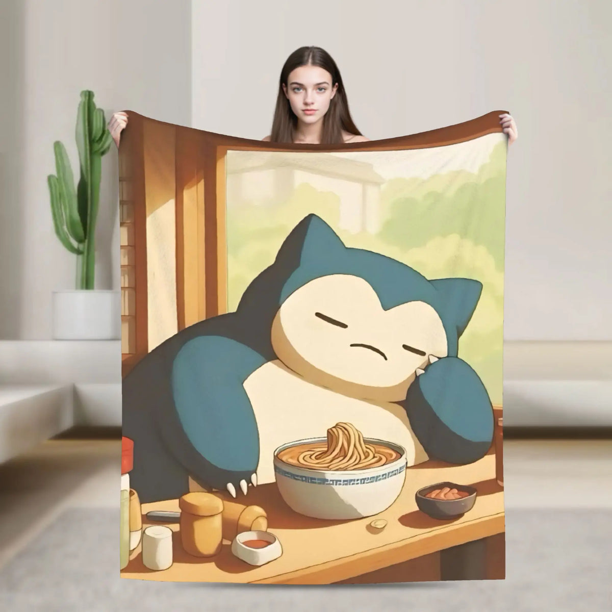A plush decorative throw blanket featuring a cartoon panda sleeping happily on a wooden table.