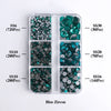 A clear plastic tray containing various sizes of blue zircon glass rhinestones categorized by SS6, SS10, SS20, and SS30.