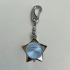 Silver star-shaped pocket watch keychain with an adjustable clock face