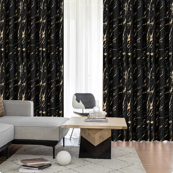 Blackout curtains with a marble pattern featuring gold veins framing a window and a modern furniture setup.