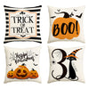 Set of four Halloween cushion covers featuring trick or treat, boo, happy halloween, and a witch cat design