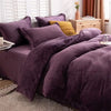 A luxurious purple flannel duvet cover set displayed on a bed with natural light and wooden furniture.