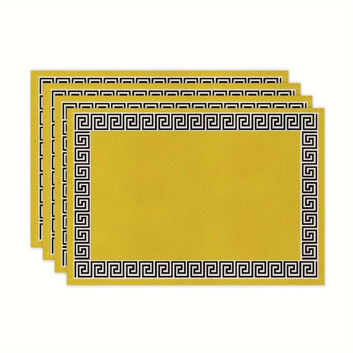 A stack of yellow linen blend table placemats with black Greek key borders.