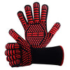 A pair of black and red heat resistant BBQ gloves with a non-slip silicone grip.