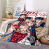 A fleece throw blanket featuring a design of Stray Kids Kpop members.