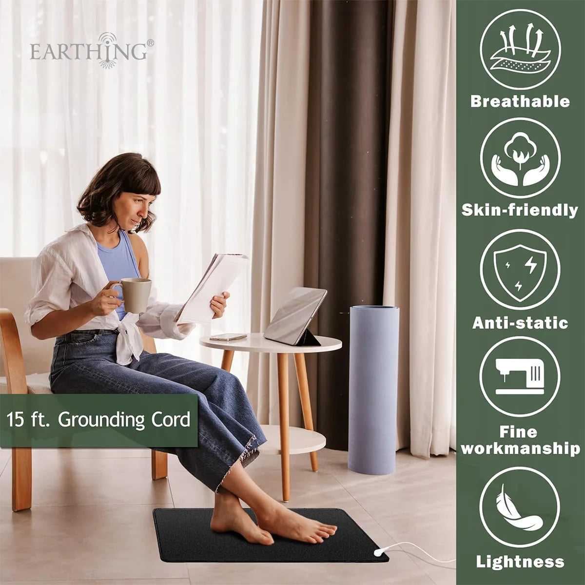 A woman sits on a mat indoors using a 15 ft grounding cord for wellness.