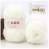 A white ball of soft coral velvet yarn labeled as QINFUSHOUZUO 02 乳白 for crafting.