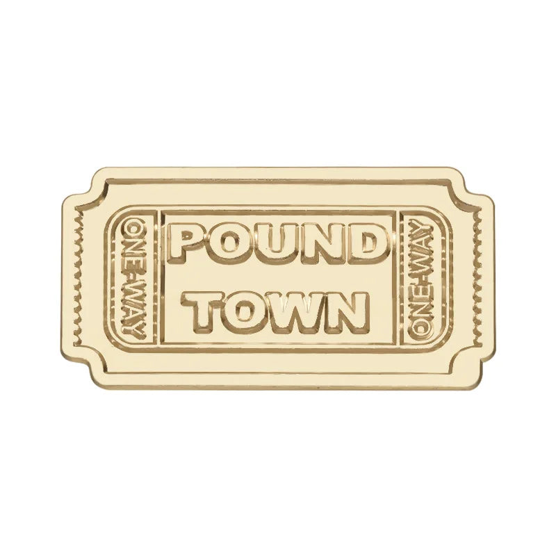 Vintage enamel airline ticket lapel pin with the text POUND TOWN surrounded by decorative lines