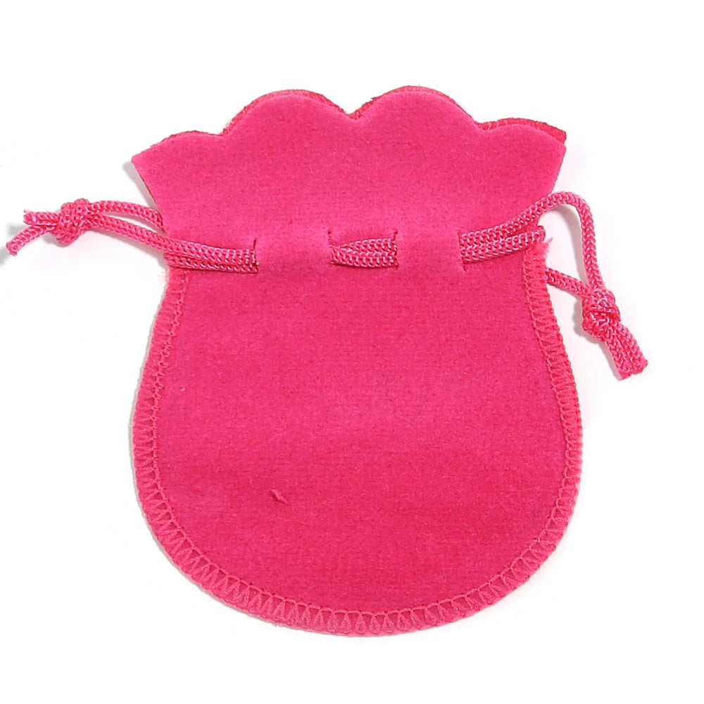 A single bright pink velvet drawstring gift bag shaped like a gourd.