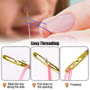 Stainless steel self-threading sewing needles demonstrating the easy threading process on a finger.