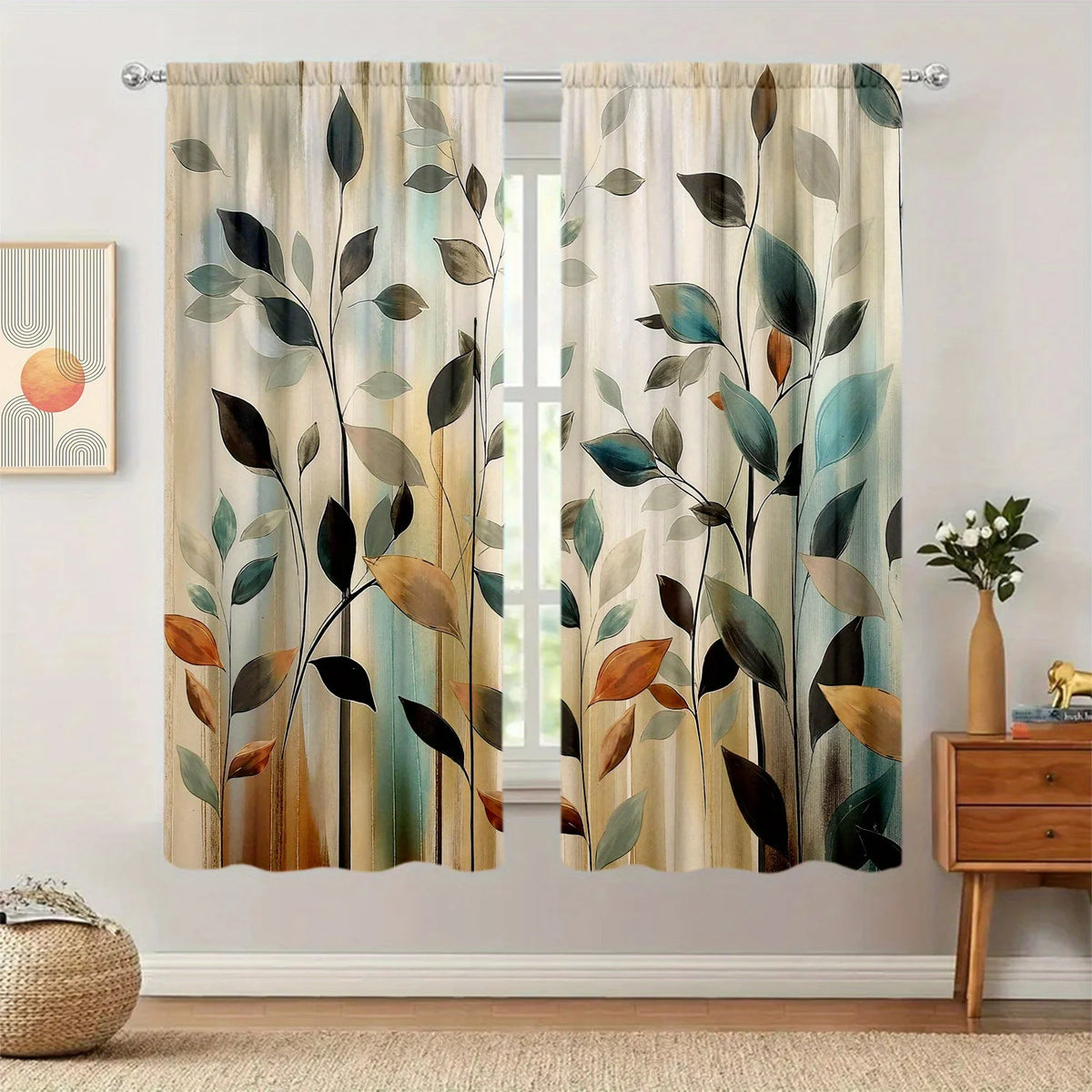 Curtains featuring an abstract print of various green and brown leaves against a light background.