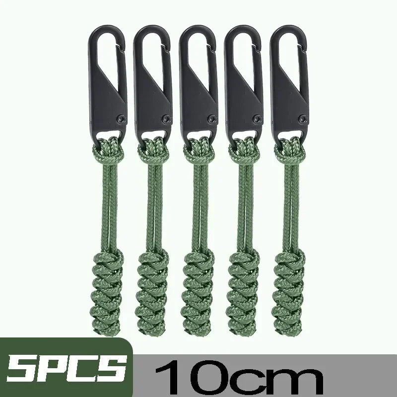 Five black detachable zipper pull sliders with green cord for bags and clothing