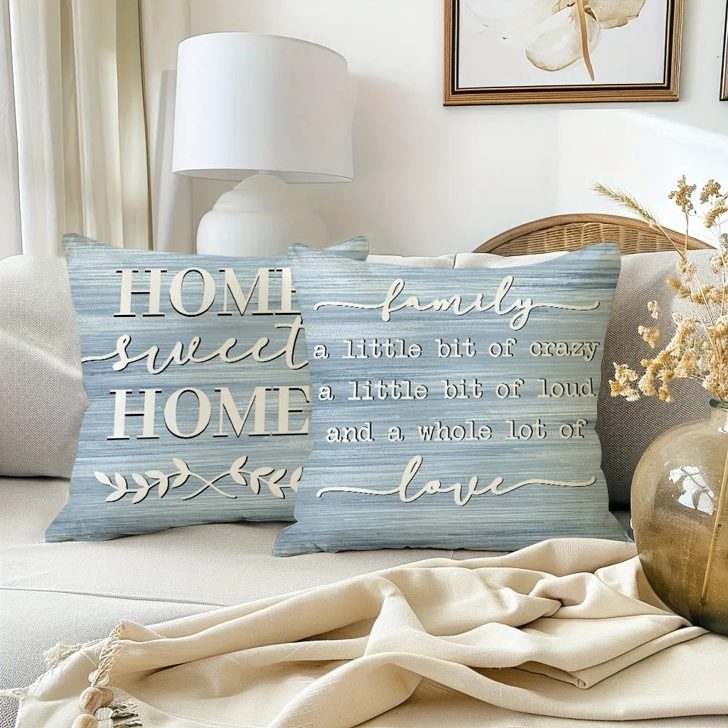 A blue linen decorative pillow cover with white script text reading Home Sweet Home family and love