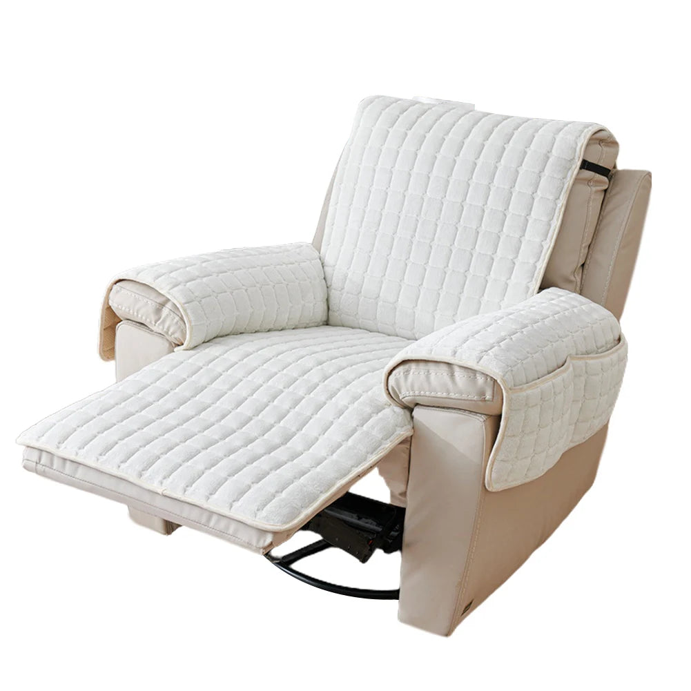 A beige quilted stretch recliner cover with storage pockets shown from the side.