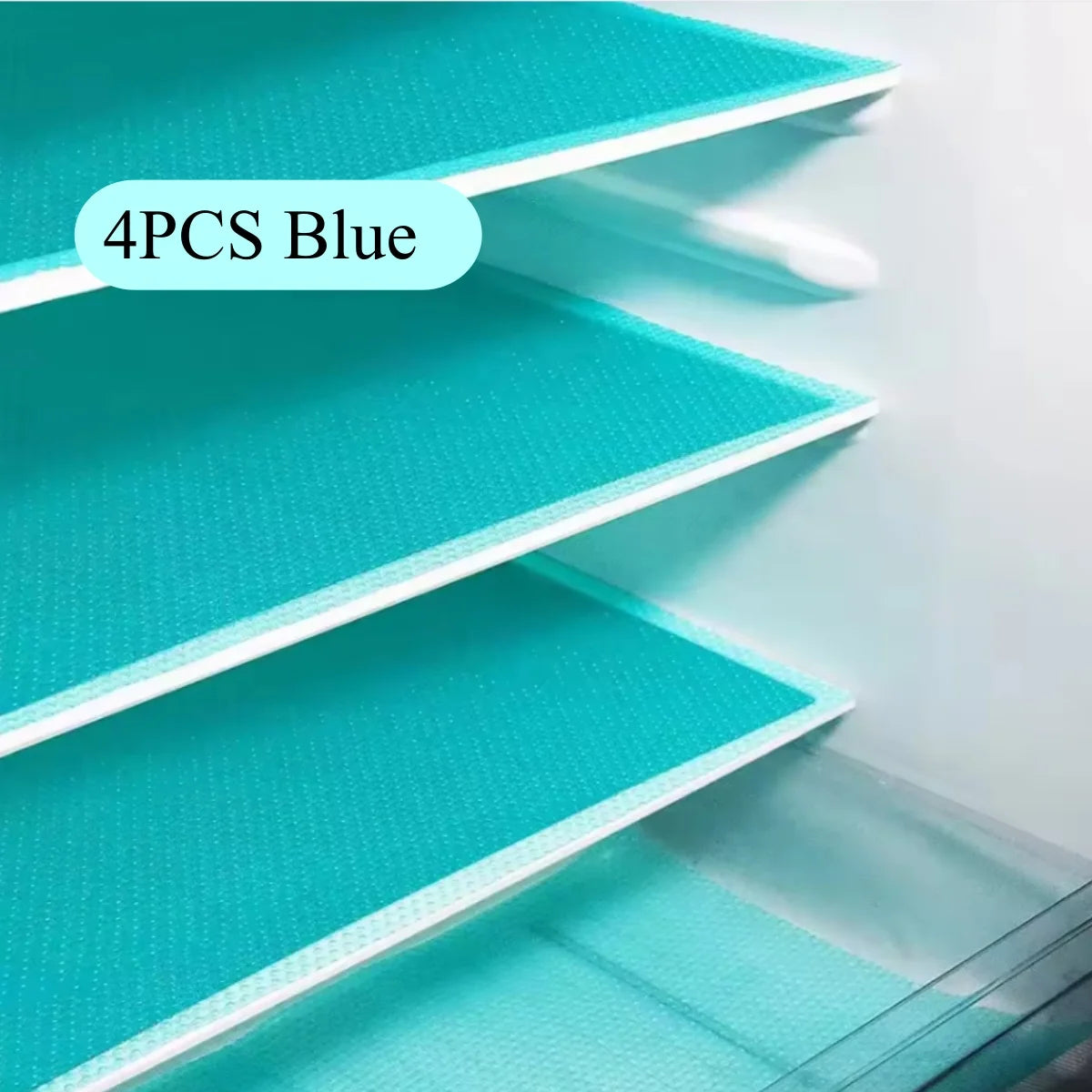 Four blue reusable silicone fridge and drawer liners displayed in a white organizer.