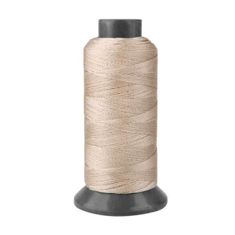 Roll of heavy duty 3-ply nylon sewing thread with a dark gray core.
