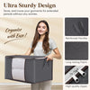 A woman is holding a gray foldable clothes organizer bag designed for storing and moving garments.