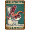 Vintage metal wall art sign featuring a menacing depiction of a dinosaur's mouth and the text DEFINITELY NOT A MIMIC