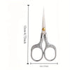 Stainless steel vintage sewing scissors with a pointed blade and silver handles