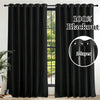 Blackout curtains with eyelet rings shown hanging in a window frame.