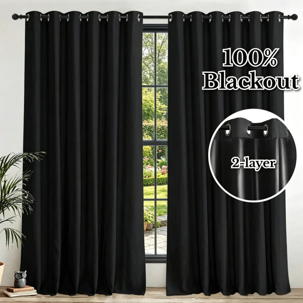 Blackout curtains with eyelet rings shown hanging in a window frame.