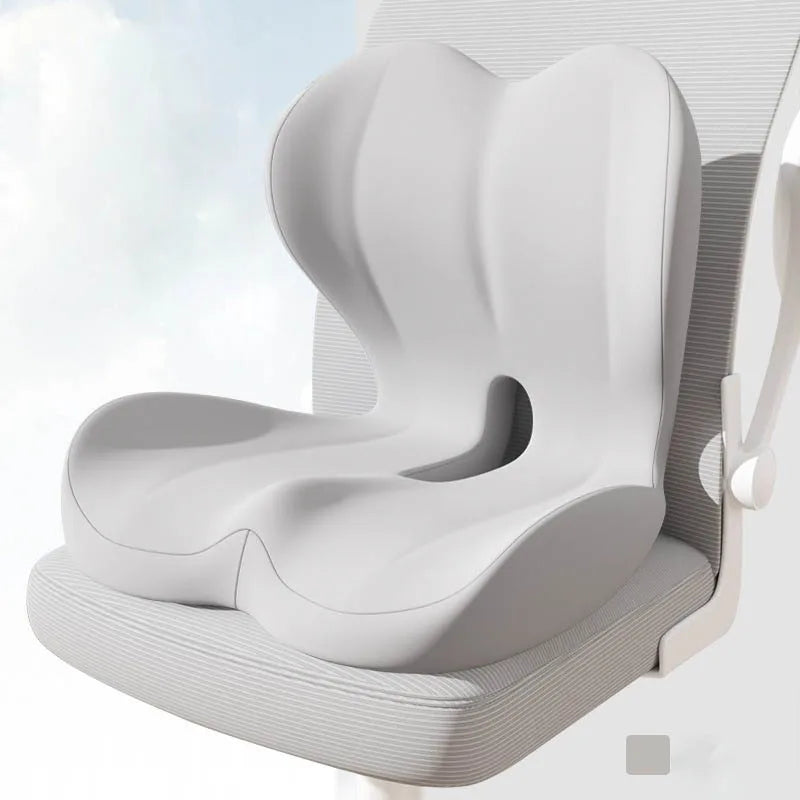 A white ergonomic memory foam lumbar seat cushion is shown in a side view.
