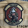 A dark brown tactical military patch featuring an eagle and the words freedom and mother.