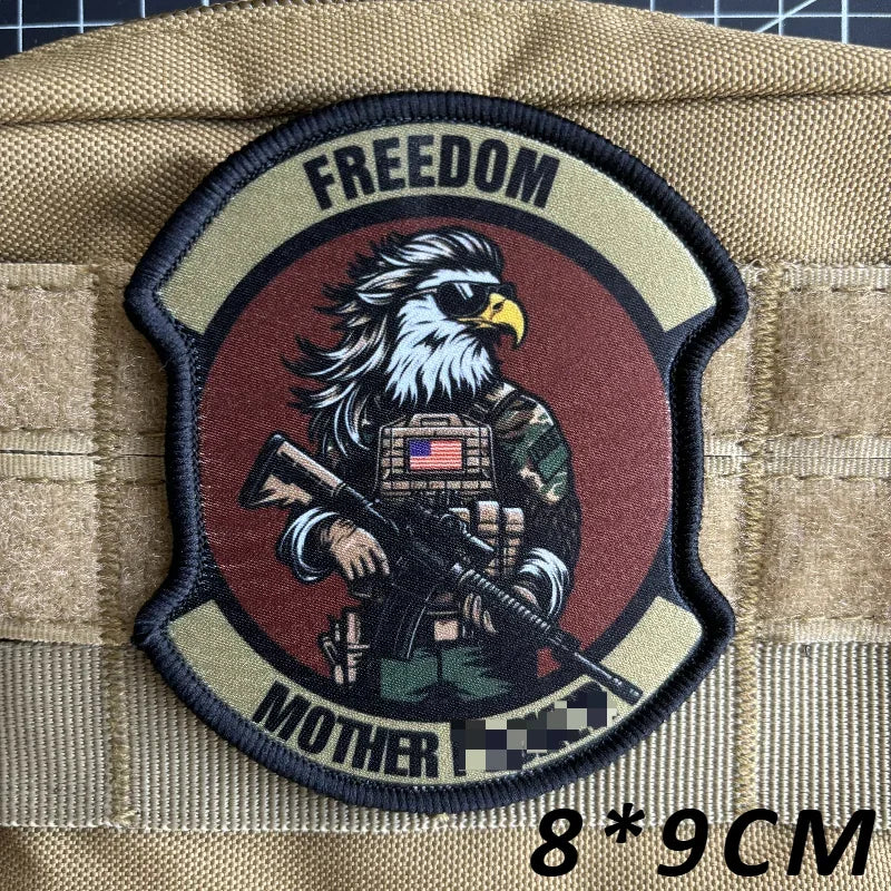 A dark brown tactical military patch featuring an eagle and the words freedom and mother.