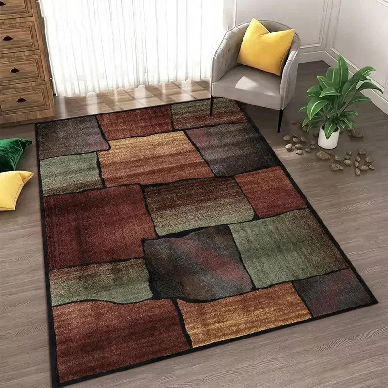 Abstract geometric area rug featuring earthy tones of brown, olive green, and charcoal on a gray floor.