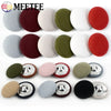 A set of round fabric-covered shank buttons in various colors including red, green, white, and gray.