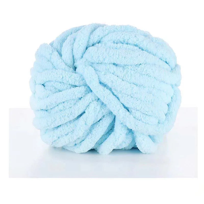 A ball of light blue chunky acrylic yarn for knitting and crochet projects.