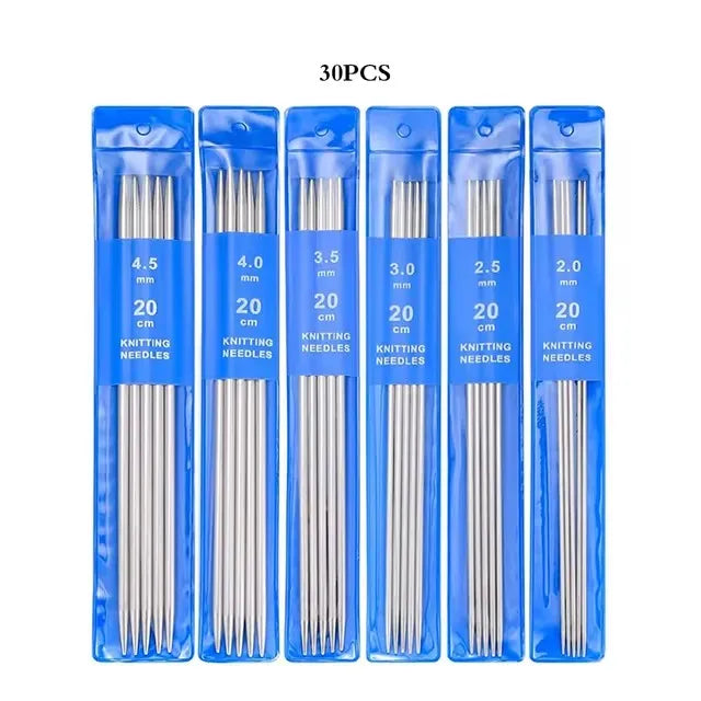 A set of stainless steel double-pointed knitting needles in various sizes, packaged in blue plastic.