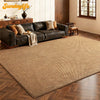 A rectangular natural fiber sisal runner rug in a tan color placed on a wooden floor.