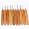 A set of ten bamboo crochet knitting needles with varying sizes displayed horizontally.