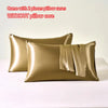 Two satin pillow cases in gold color without a pillow core